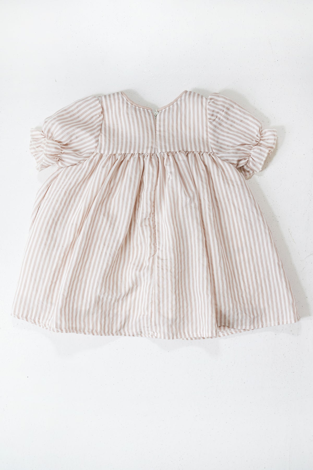 Beige Striped Emily Frock flat lay showing beige stripe fabric and shape