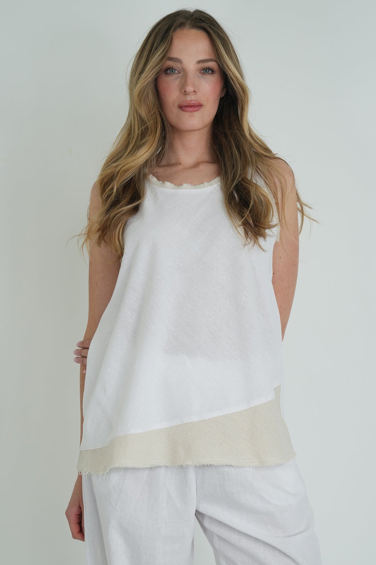 White Emily Vest, a white top from Something Pretty