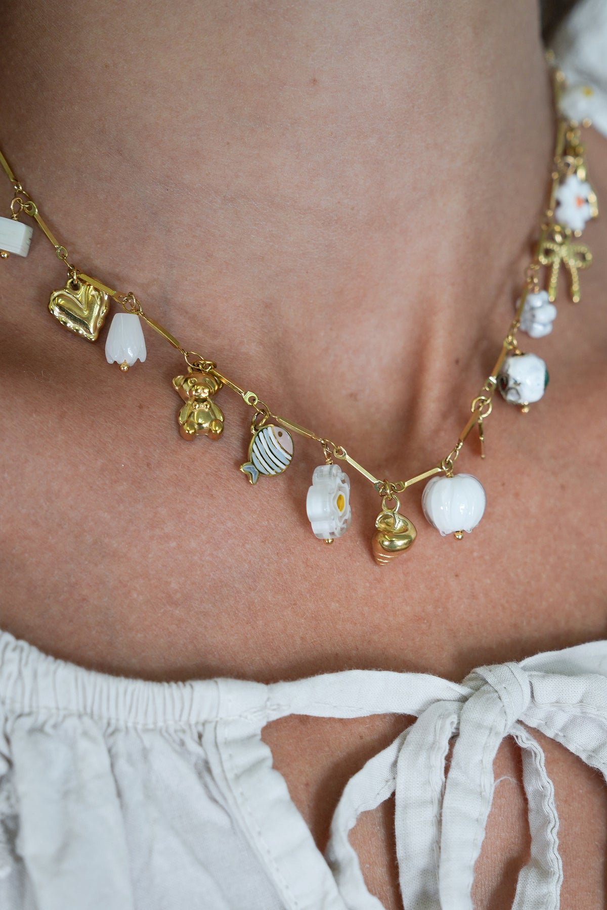 White Daisy Charm Necklace, a necklace from Something Pretty