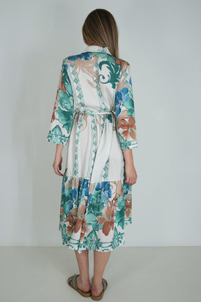 Woman wearing a floral dress with a white background