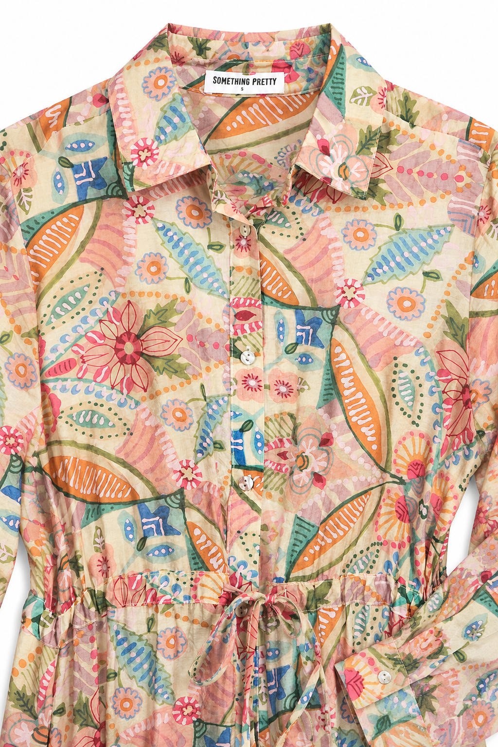 Colorful patterned dress with a brand label on a white background