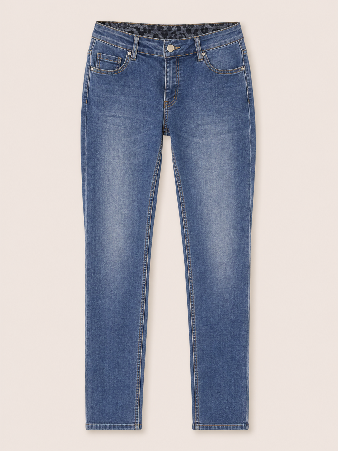 Blue jeans on a light beige background