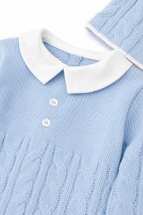 Light blue sweater with white collar and buttons on a white background