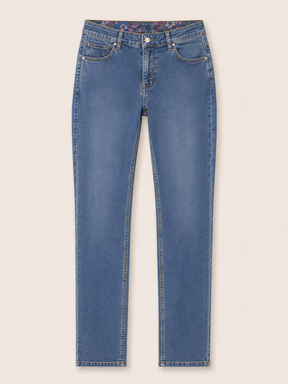 Blue jeans on a light beige background