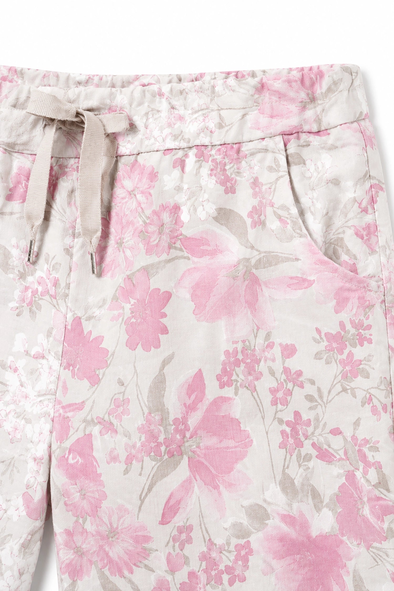 Floral patterned pants with pink flowers on a white background