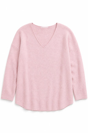 Pink sweater on a white background