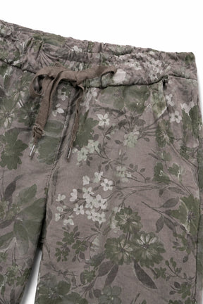 Floral-patterned pants with a drawstring on a white background