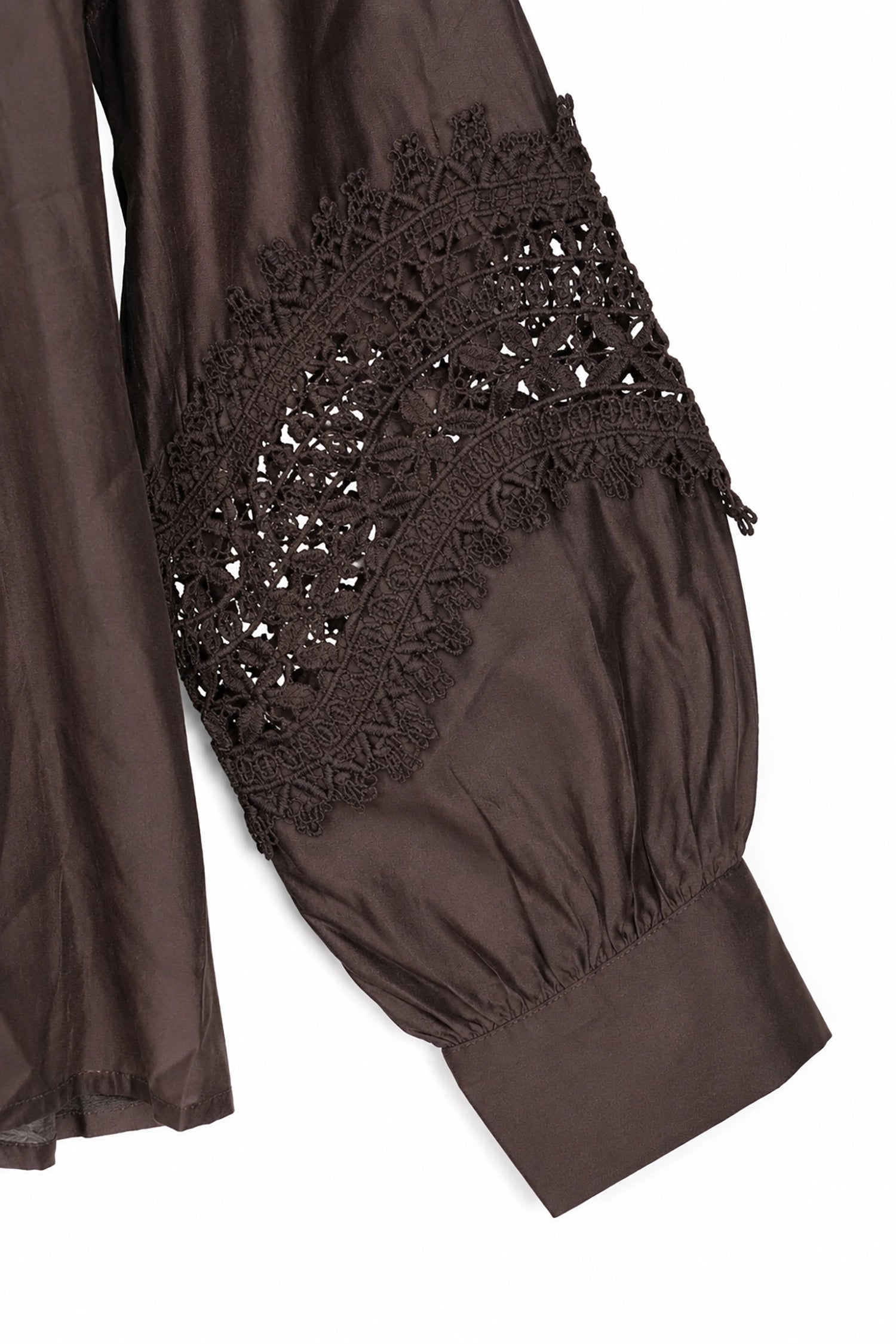 Brown garment with lace detailing on a white background