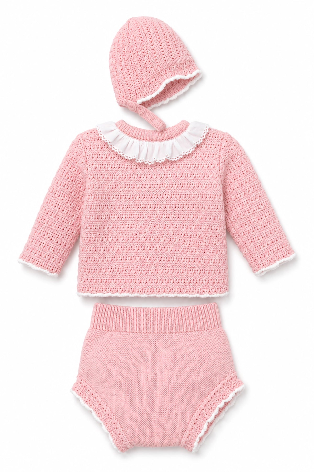 Pink knitted outfit with a hat on a white background