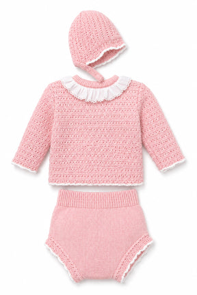 Pink knitted outfit with a hat on a white background