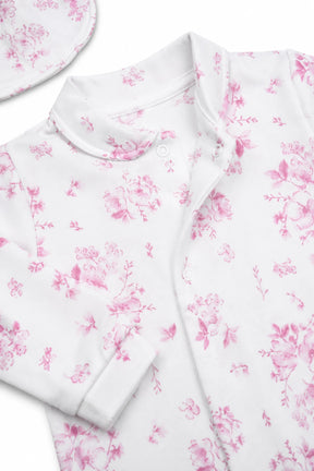 White fabric with pink floral pattern on a white background