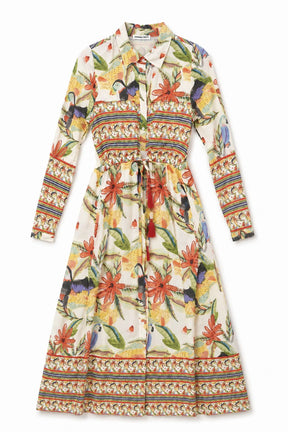 Colorful floral and bird patterned dress on a white background