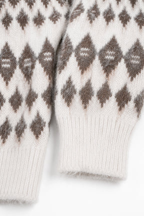 Close-up of white mittens with brown diamond pattern on a white background