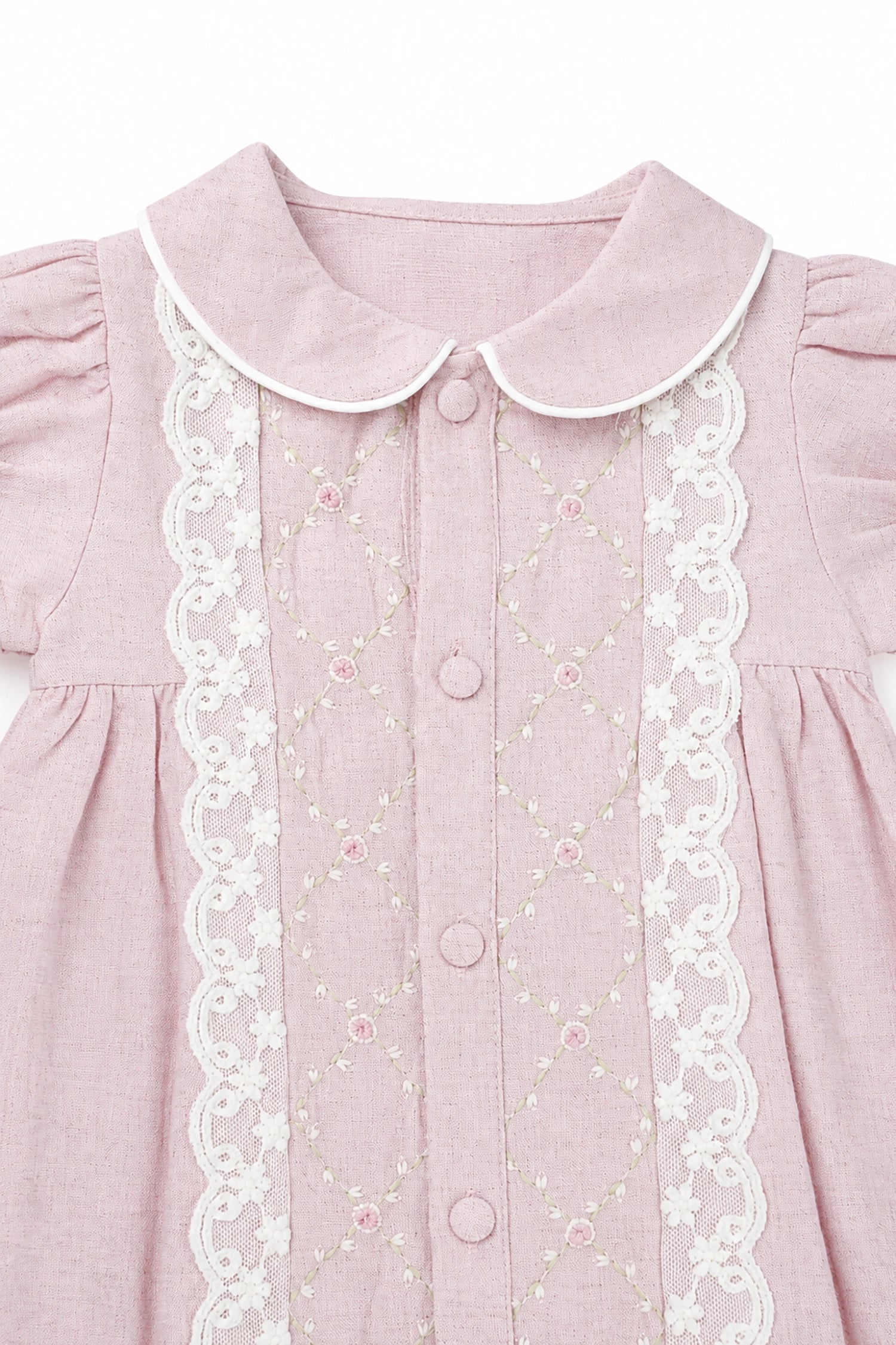 Pink dress with white lace details on a white background