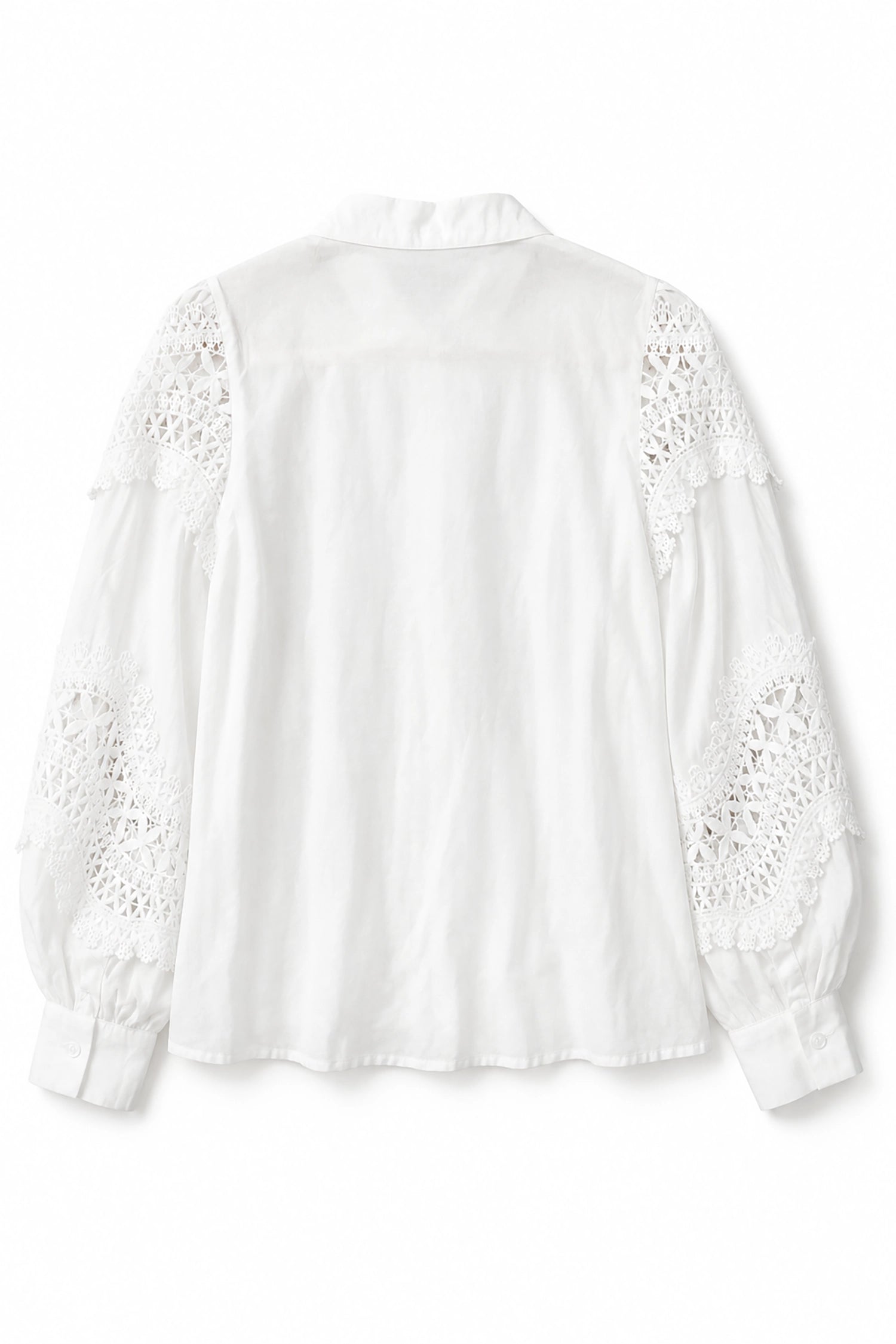 White blouse with lace details on a white background